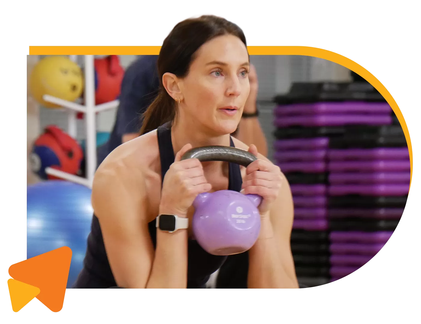 woman holding kettle bell