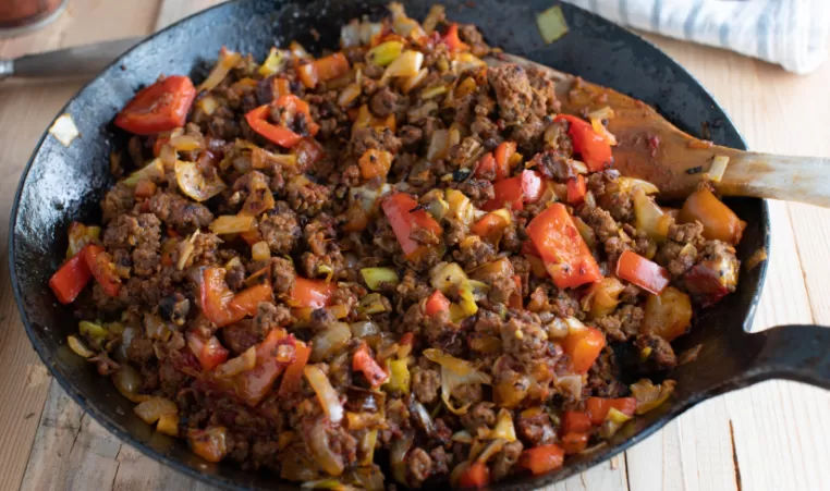 Ground beef and cabbage in a skillet
