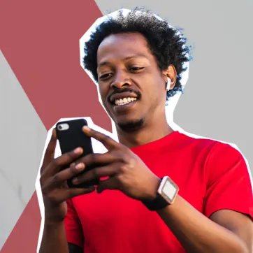 man in athletic clothing texting on phone