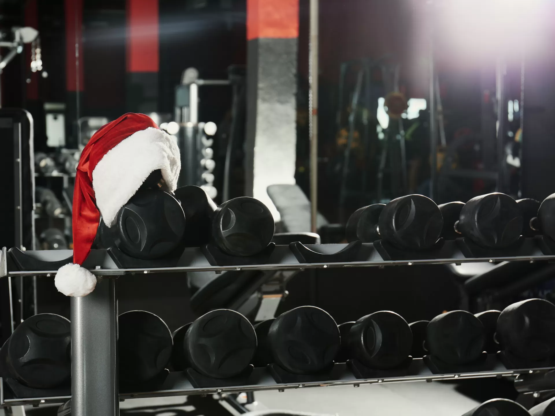 Santa hat on dumbbell rack