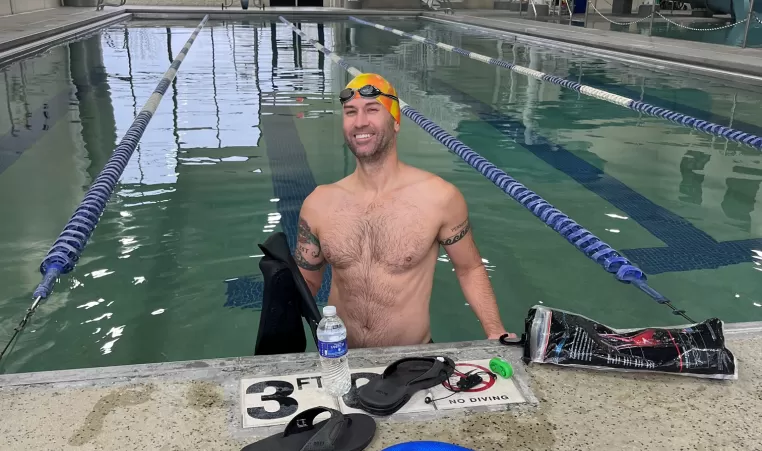 Man smiling in the pool