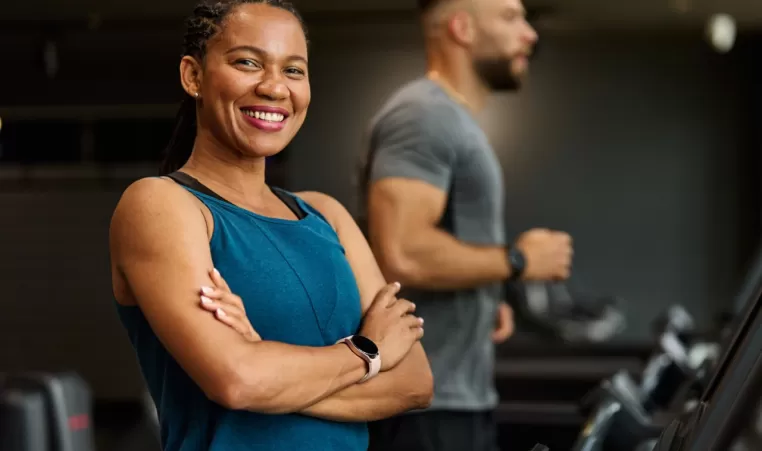 smiling woman on a treadmill