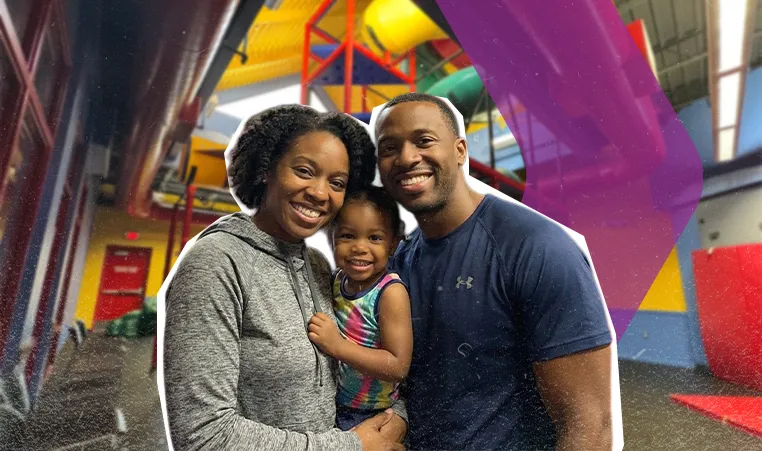 Family of three smiling in YMCA Child Watch