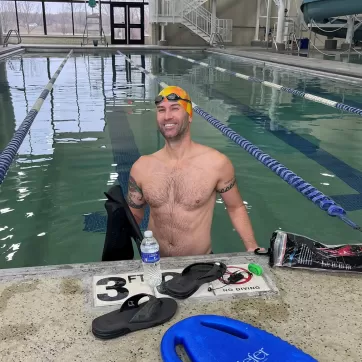 Man smiling in the pool