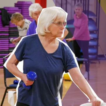 senior woman in a group exercise class