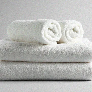 folded white towels on a white background